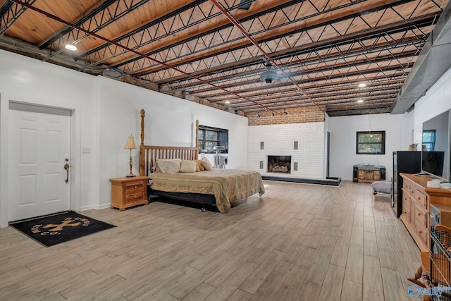 411 Darby Ave, Sheffield, AL 35660 - bedroom with a high ceiling, baseboards, and wood finished floors