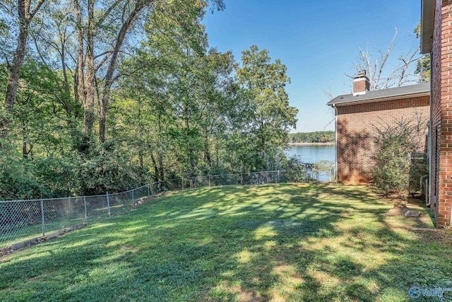 411 Darby Ave, Sheffield, AL 35660 - view of yard featuring a fenced backyard and a water view