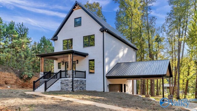 view of front of home with a garage and covered porch