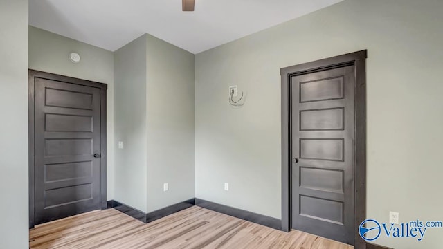 unfurnished room with wood-type flooring