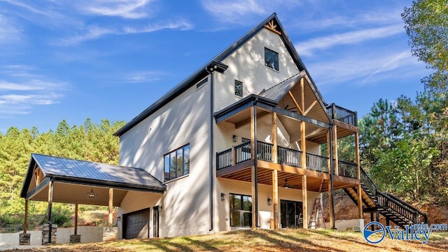 rear view of house featuring a garage