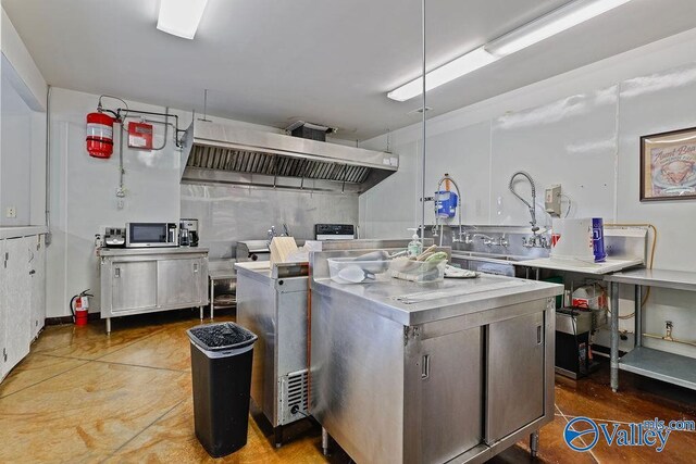 dining space featuring concrete floors