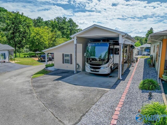 exterior space with a carport