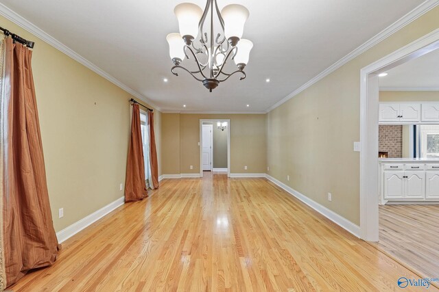 unfurnished room with light hardwood / wood-style flooring, a chandelier, and ornamental molding