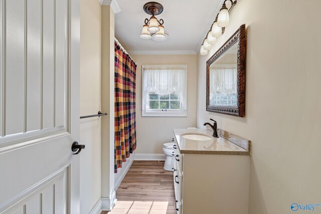 bathroom with hardwood / wood-style flooring, vanity, crown molding, toilet, and a shower with curtain