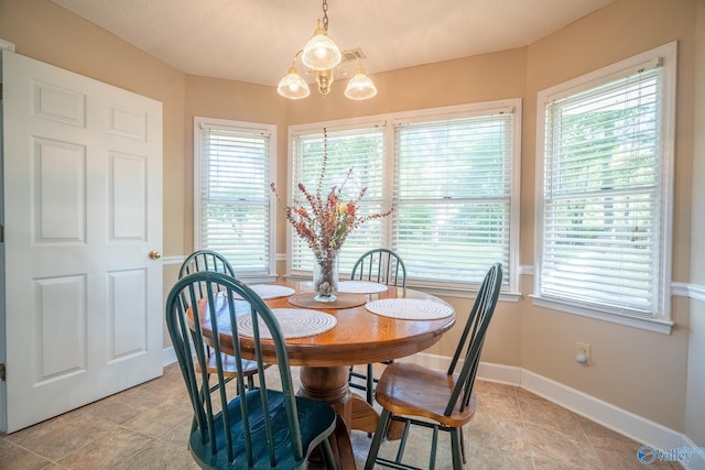 142 Raspberry Way, Madison, AL 35757 - dining area with a chandelier and light tile patterned floors