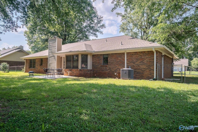 142 Raspberry Way, Madison, AL 35757 - rear view of property with brick siding, a chimney, and a fenced backyard