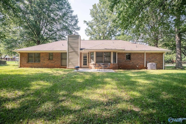 142 Raspberry Way, Madison, AL 35757 - back of property with a patio, a chimney, and brick siding