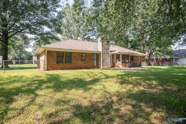 142 Raspberry Way, Madison, AL 35757 - rear view of property featuring a chimney, a fenced backyard, brick siding, and a patio area