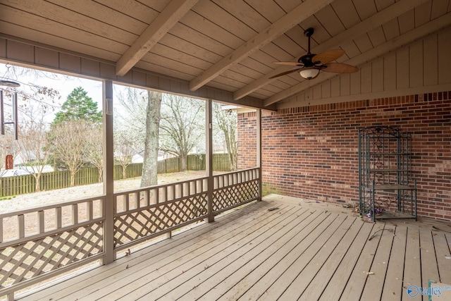 wooden deck featuring a ceiling fan and fence