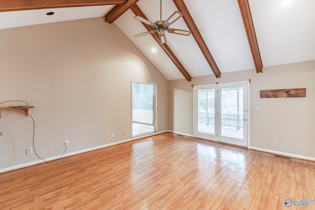 unfurnished living room with light wood-type flooring, high vaulted ceiling, beamed ceiling, and a ceiling fan