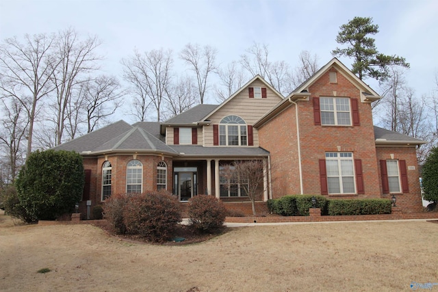 view of property featuring a front lawn