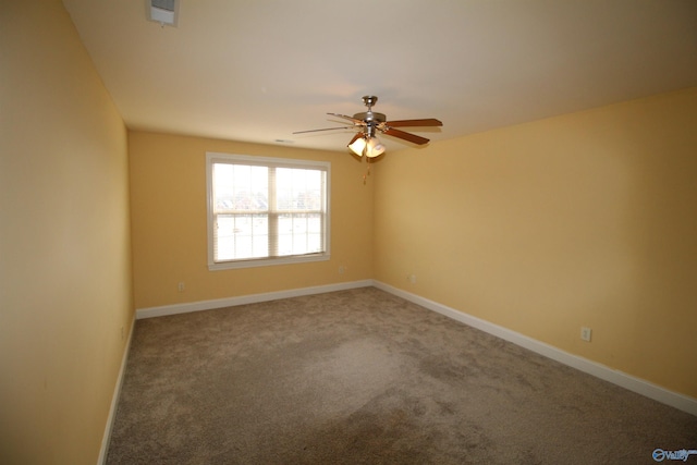 empty room with carpet flooring and ceiling fan