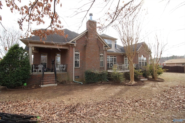 back of property featuring a porch