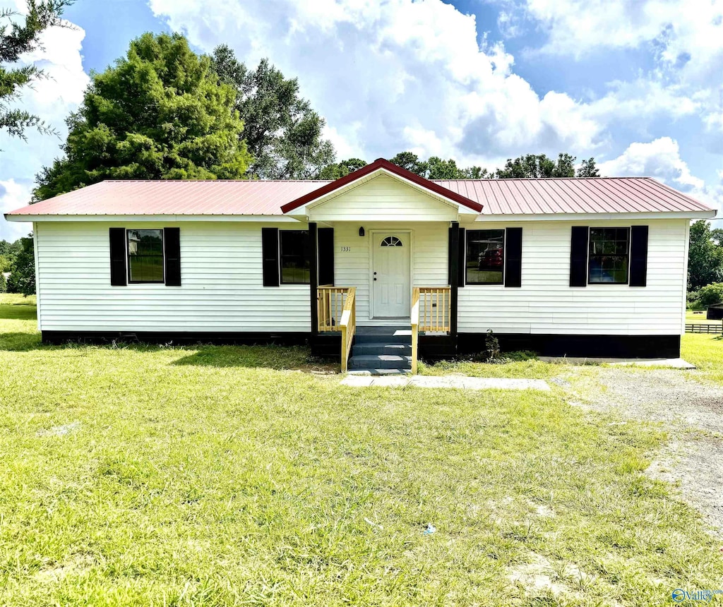 1331 Arlington Rd, Arab, AL 35016 - view of front of house with a metal roof and a front lawn