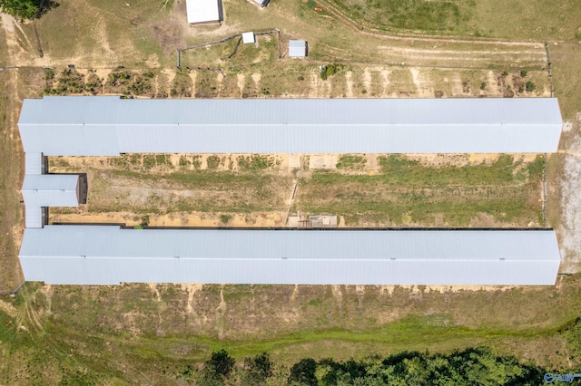 birds eye view of property with a rural view