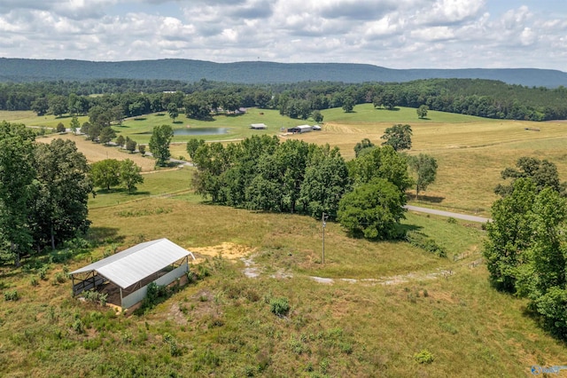 birds eye view of property with a water and mountain view and a rural view