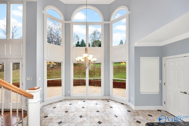 unfurnished sunroom with a wealth of natural light and a chandelier