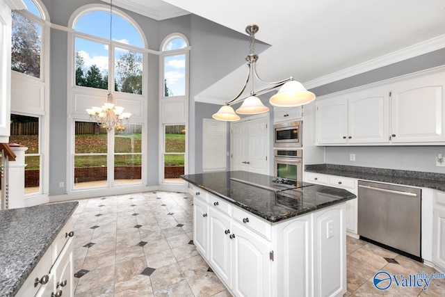 kitchen featuring white cabinetry, crown molding, pendant lighting, and appliances with stainless steel finishes