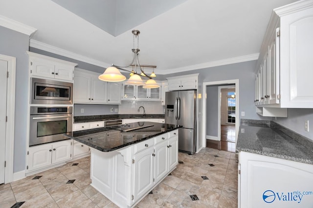 kitchen featuring white cabinets, a center island, ornamental molding, and appliances with stainless steel finishes