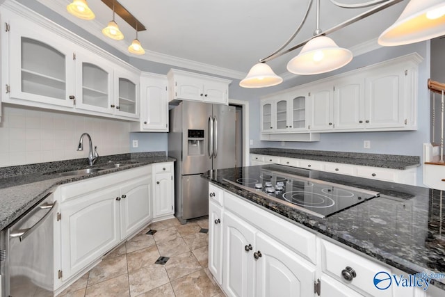 kitchen featuring white cabinets, pendant lighting, and appliances with stainless steel finishes