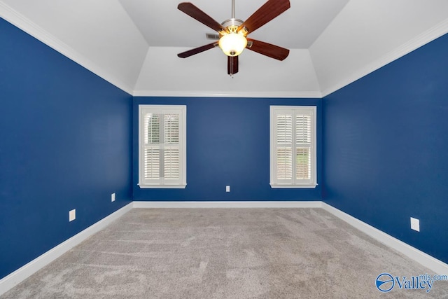 carpeted empty room with ornamental molding, ceiling fan, and lofted ceiling