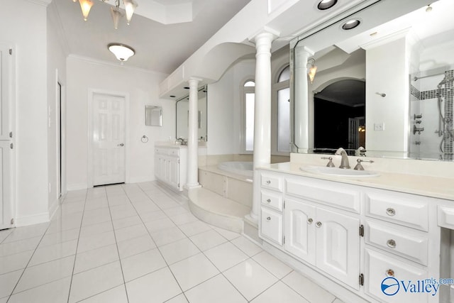 bathroom featuring decorative columns, tile patterned floors, shower with separate bathtub, vanity, and ornamental molding