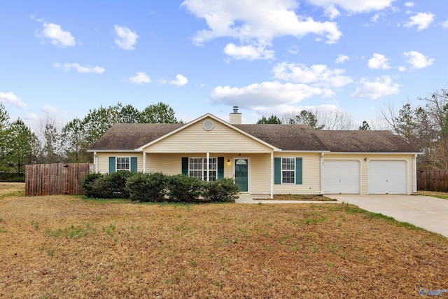 ranch-style house featuring a garage and a front lawn