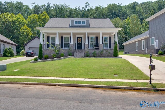 view of front facade with a porch and a front yard