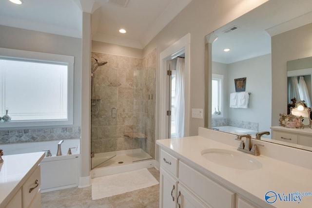 bathroom featuring a garden tub, crown molding, visible vents, a shower stall, and vanity