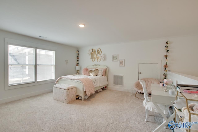 bedroom with carpet floors, visible vents, and baseboards