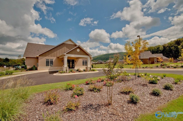 craftsman inspired home featuring board and batten siding