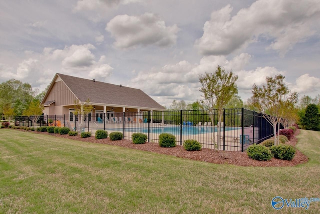 pool featuring fence and a lawn