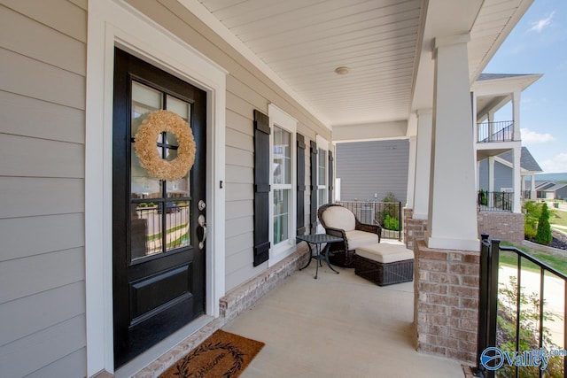 view of exterior entry with a porch