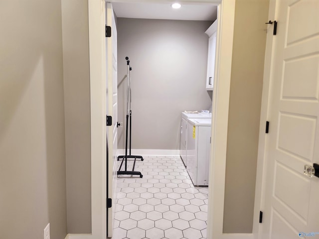 laundry room featuring recessed lighting, washer and dryer, baseboards, and cabinet space