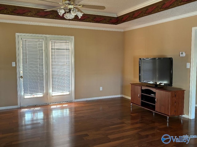 unfurnished living room with ornamental molding, dark hardwood / wood-style floors, and ceiling fan