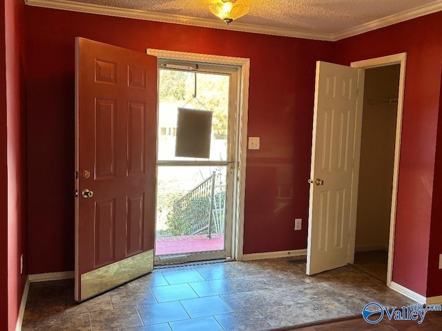 entryway featuring a textured ceiling and ornamental molding