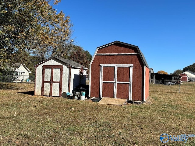 view of outbuilding with a yard