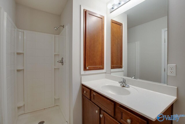 bathroom with a shower and vanity