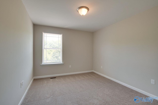 unfurnished room with carpet floors