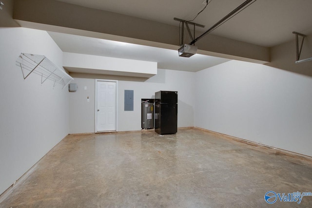 garage featuring electric panel, a garage door opener, black refrigerator, and water heater