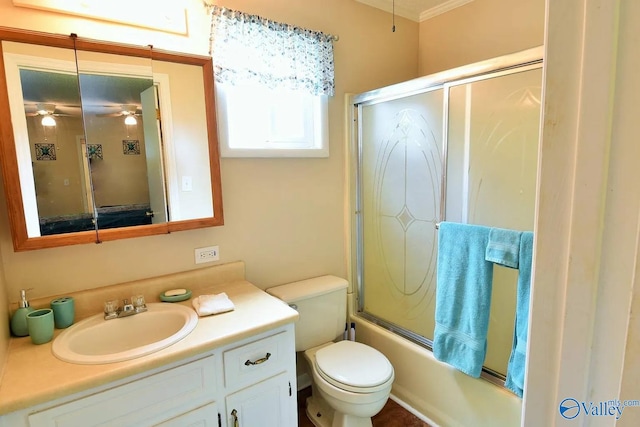 full bathroom with vanity, ceiling fan, bath / shower combo with glass door, and toilet