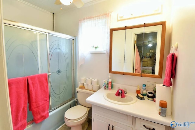 full bathroom featuring vanity, ceiling fan, shower / bath combination with glass door, and toilet