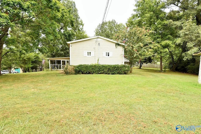 view of yard with a sunroom