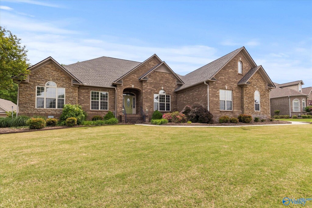 17174 Leatherwood Dr, Athens, AL 35611 - view of front facade with brick siding, a front yard, and a shingled roof