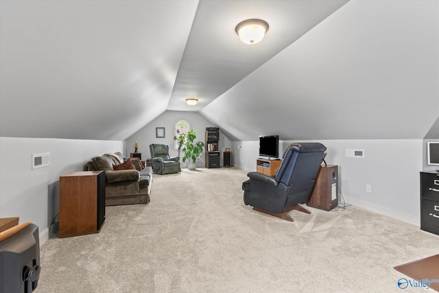 interior space featuring baseboards, visible vents, carpet flooring, and vaulted ceiling