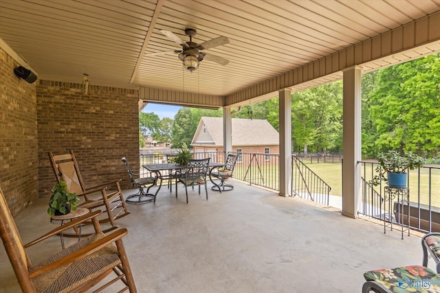view of patio / terrace featuring outdoor dining area and a ceiling fan
