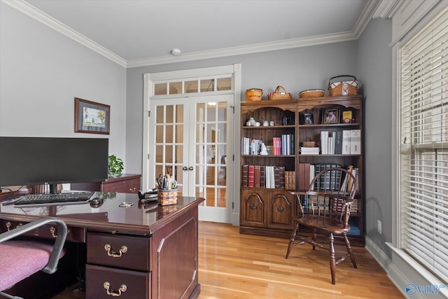 office space with baseboards, ornamental molding, french doors, and light wood-style floors