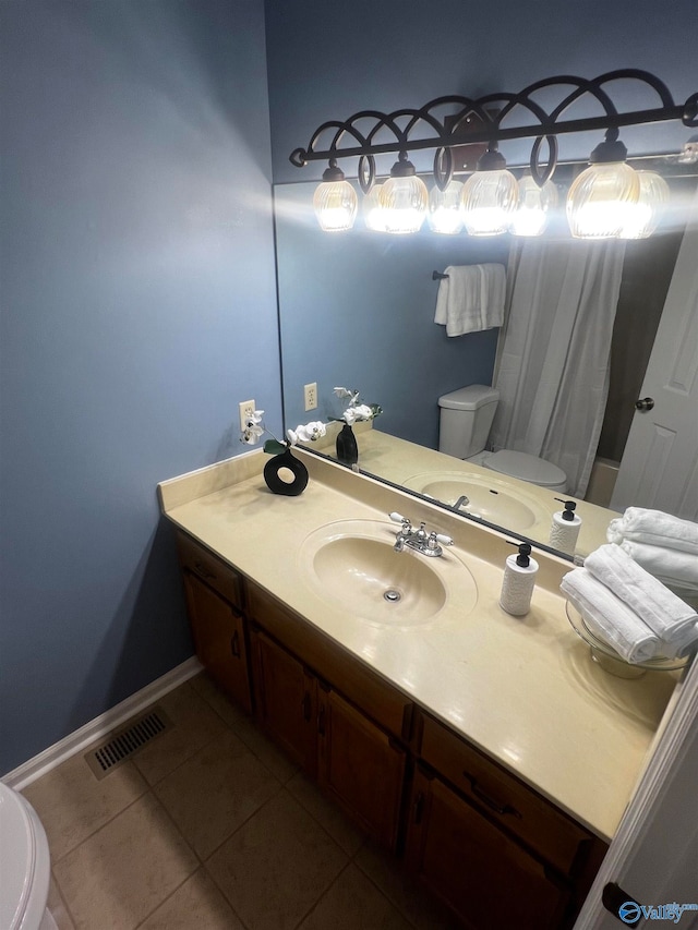 full bathroom with toilet, vanity, visible vents, and tile patterned floors