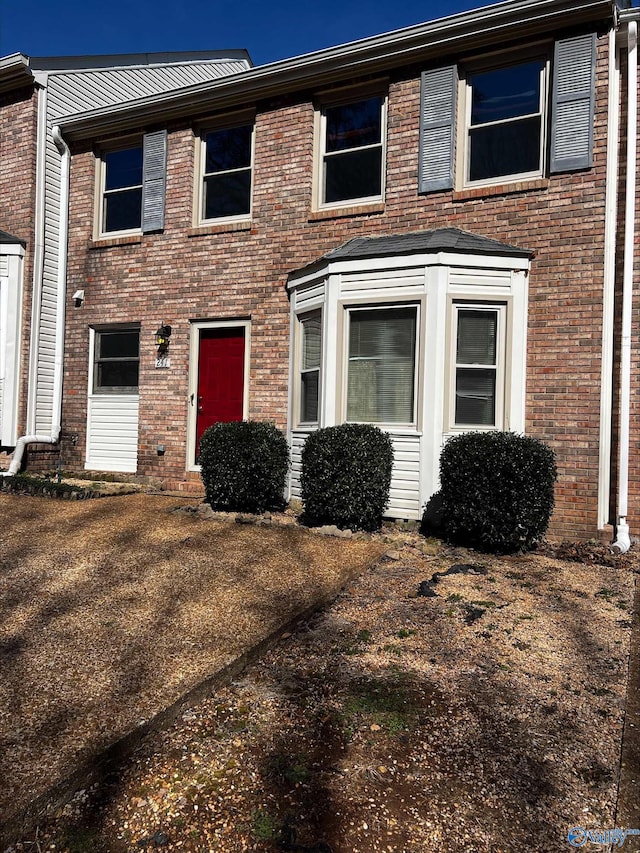 view of front of property featuring brick siding